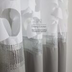 Zasłony ozdobne, wycinane laserowo na przelotkach- jasnoszara