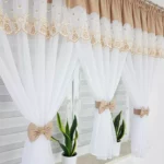 Firana z haftem zdobiona uroczymi kokardami-beżowa  300x150cm