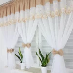 Firana z haftem zdobiona uroczymi kokardami-beżowa  300x150cm