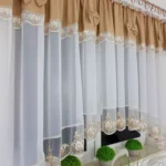 Firana gotowa 400x160 cm z brązowymi kokardkami i haftem